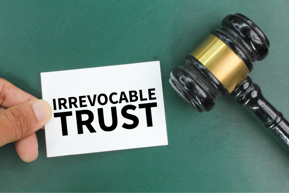 Gavel next to irrevocable trust card.